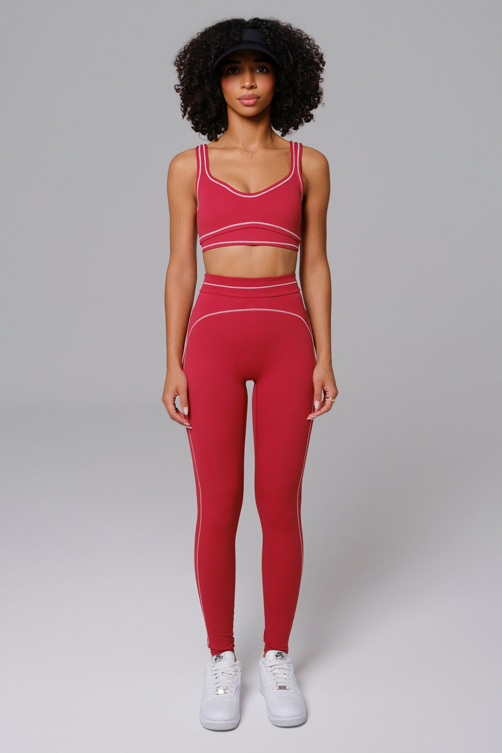 Woman wearing a cherry red athleisure set