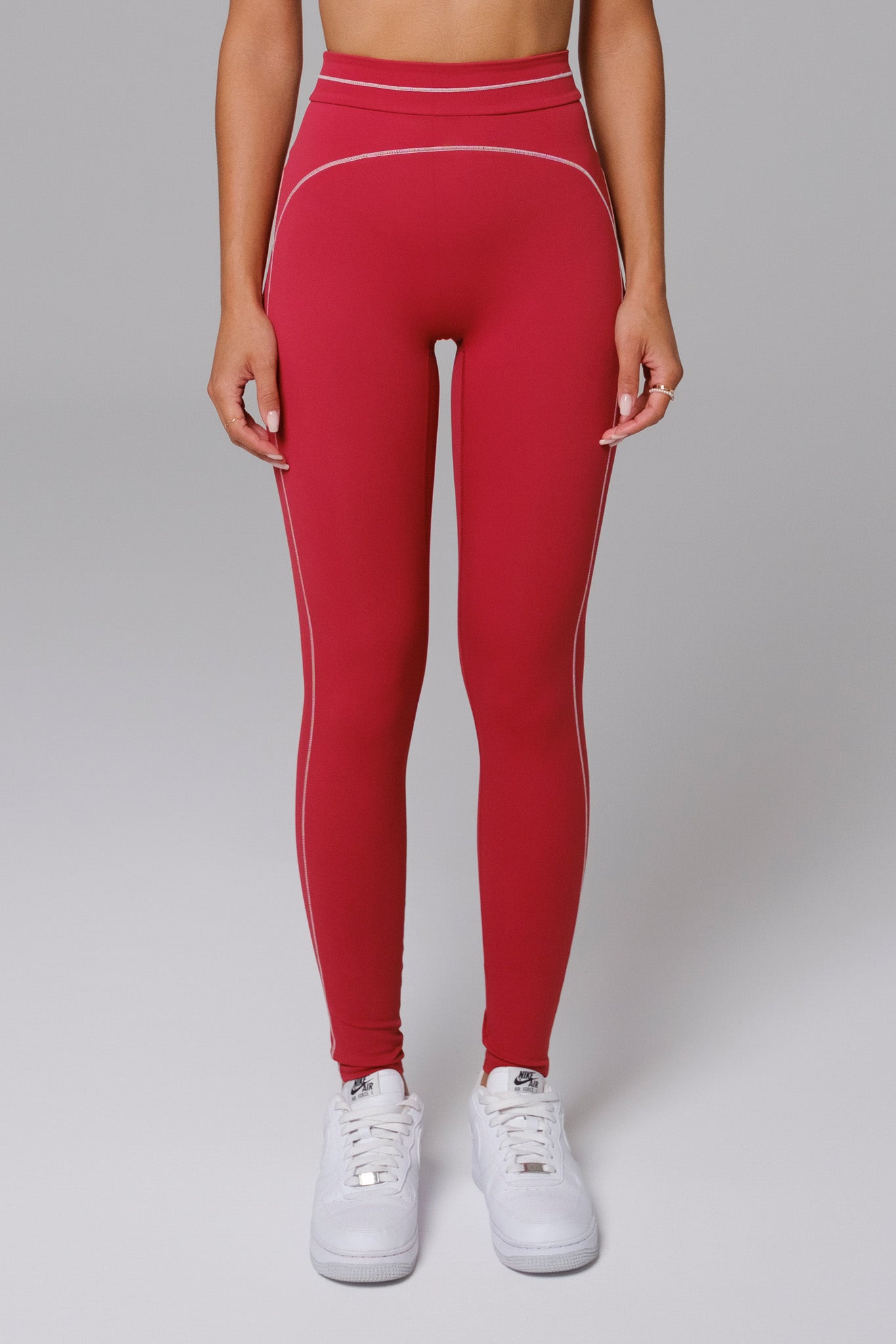 Woman wearing cherry red leggings