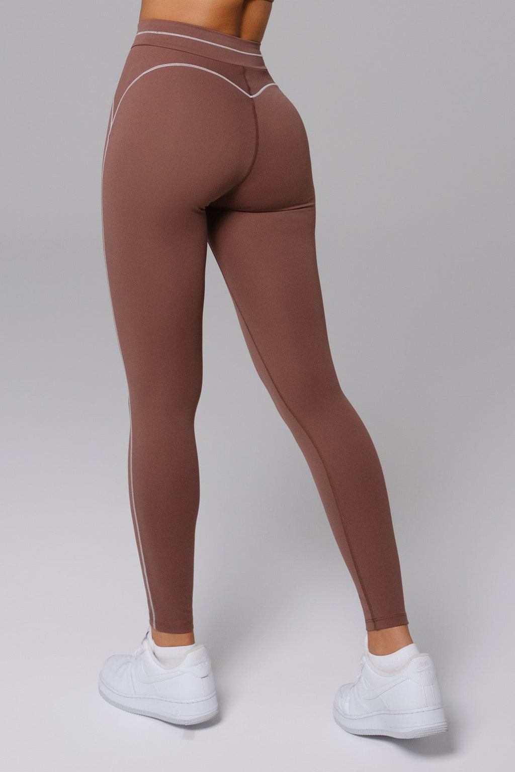 Woman wearing leggings in mocha