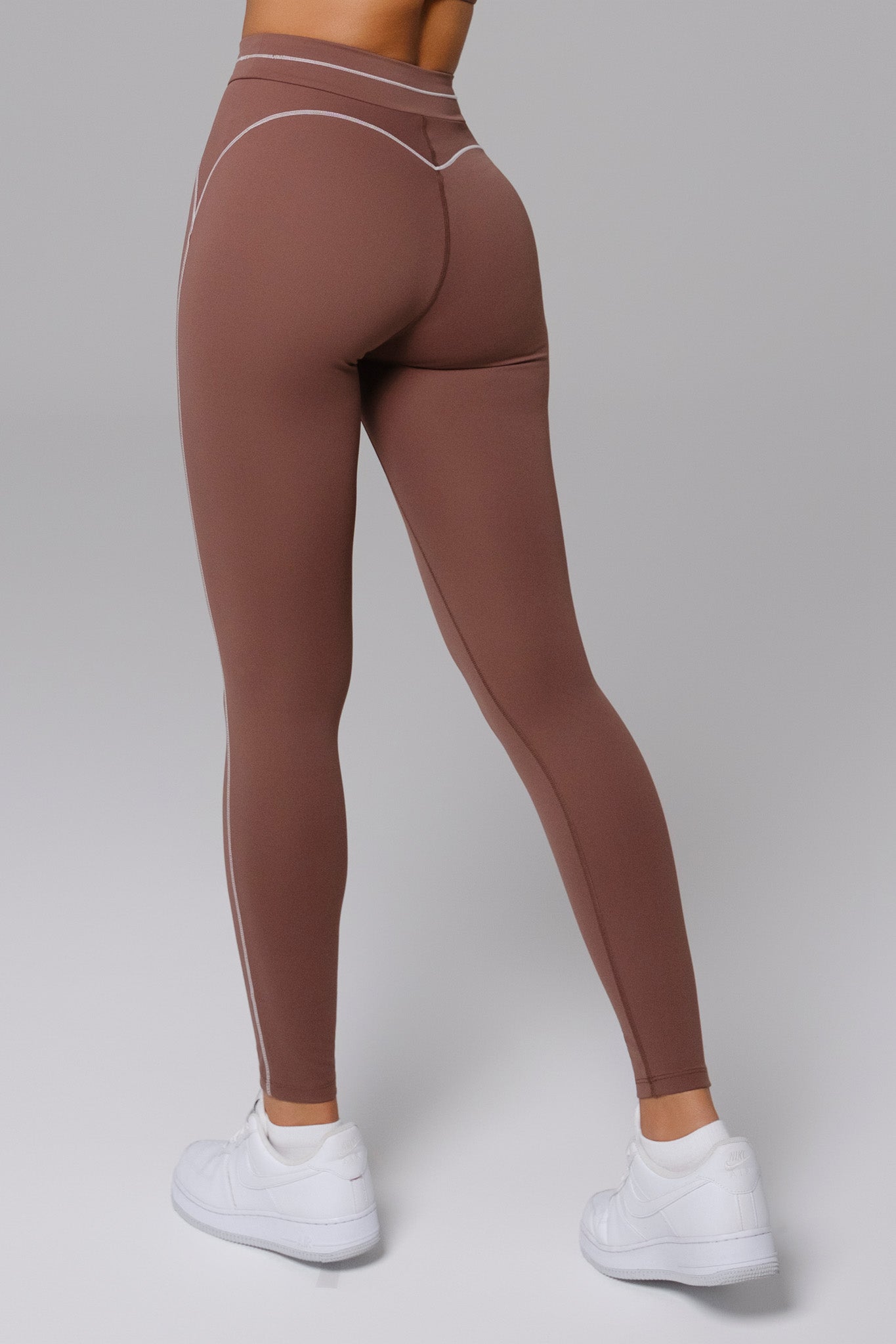 Woman wearing leggings in mocha