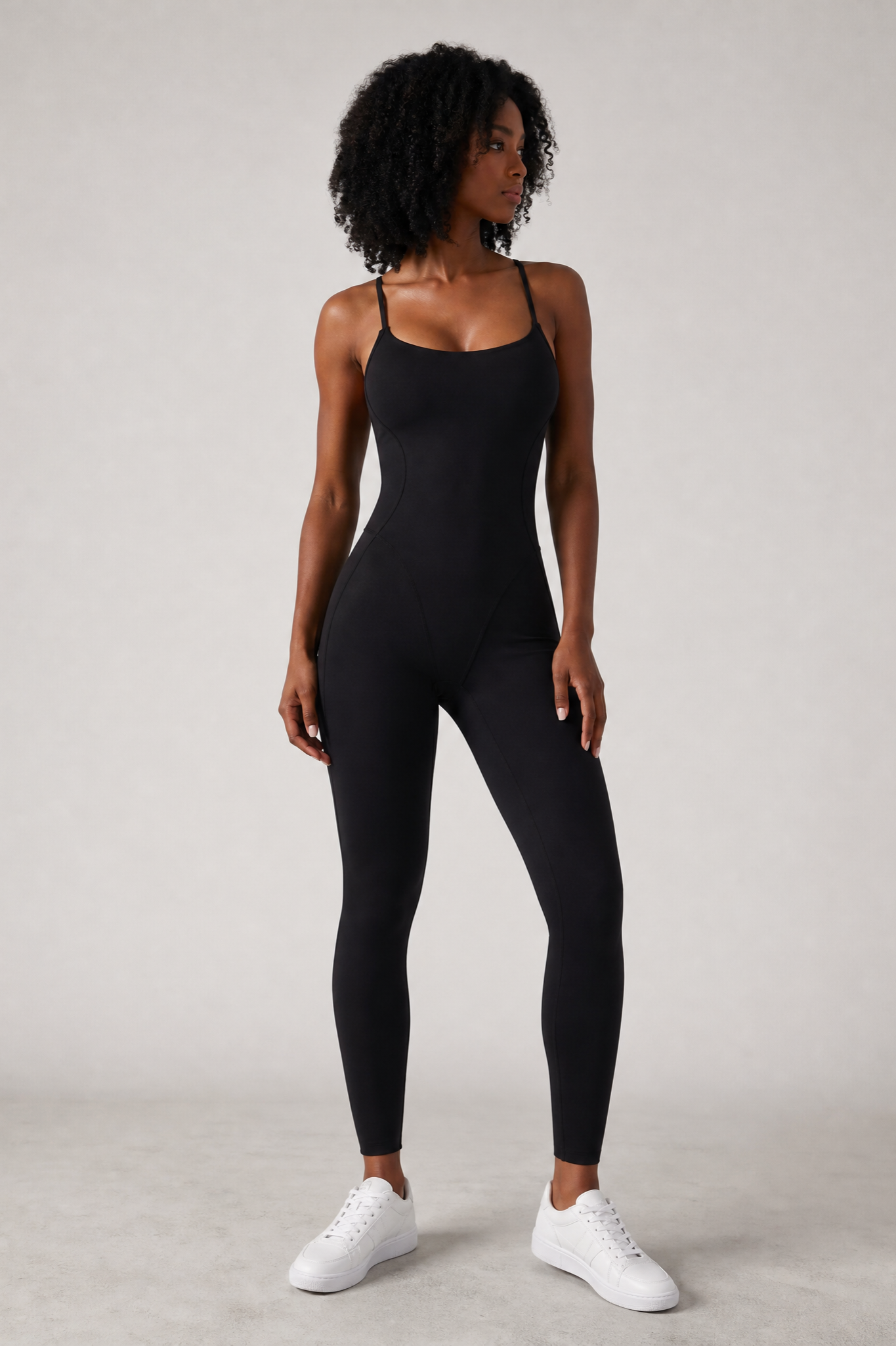 Woman wearing the Sculpt jumpsuit in Black