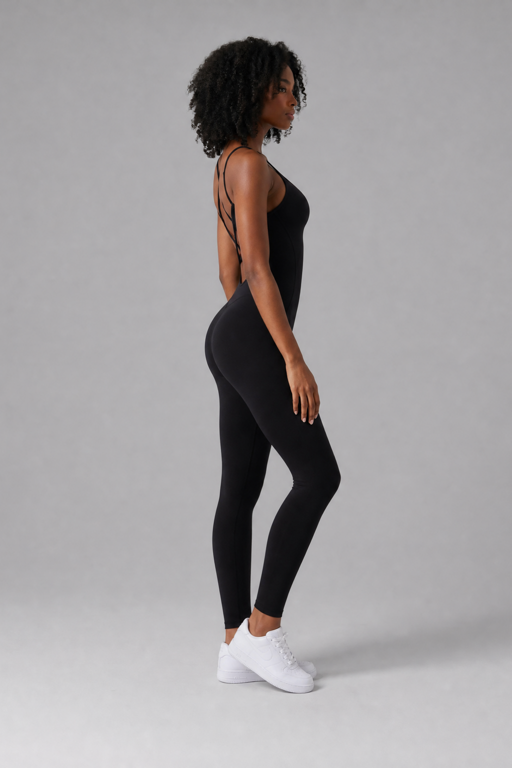 Woman wearing the Sculpt jumpsuit in Black
