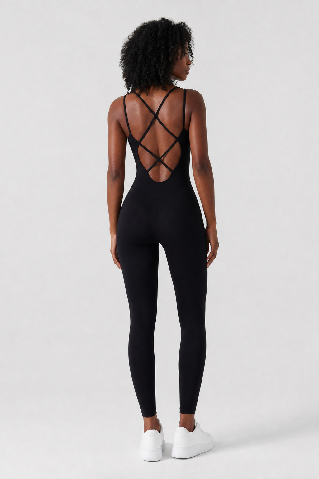 Woman wearing the Sculpt jumpsuit in Black