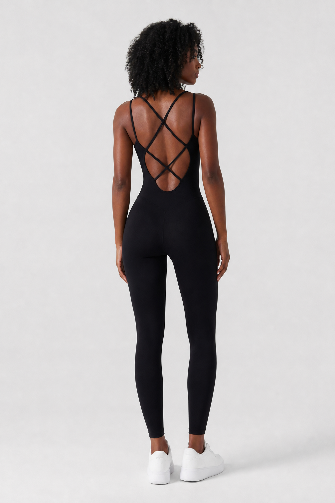 Woman wearing the Sculpt jumpsuit in Black