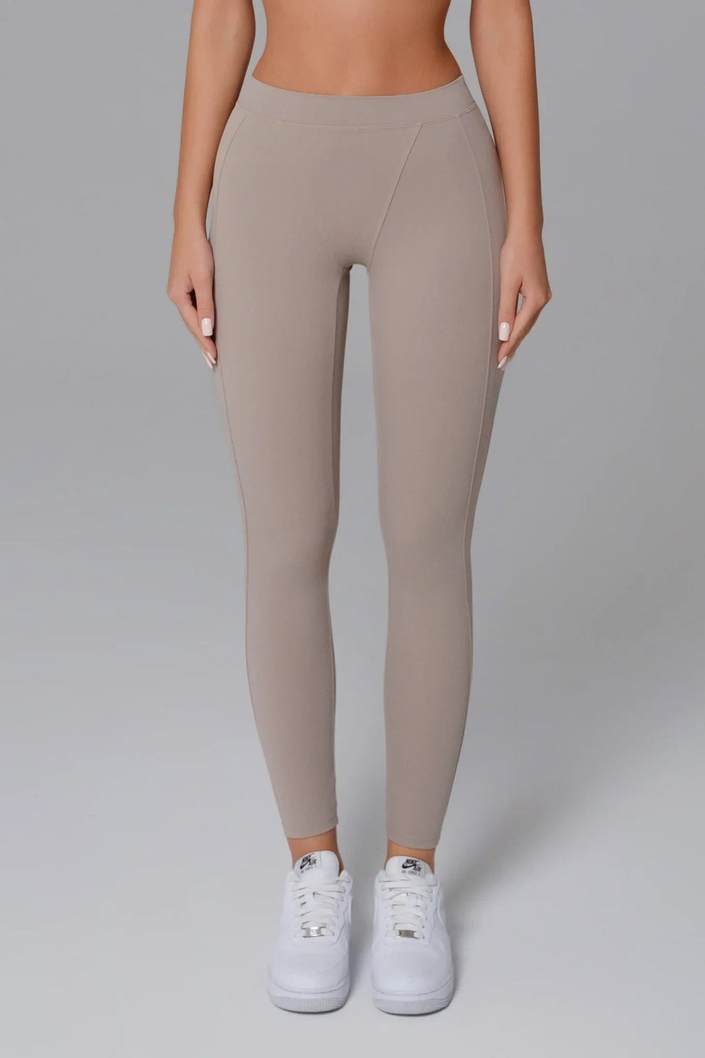 Ash Taupe leggings worn by a woman