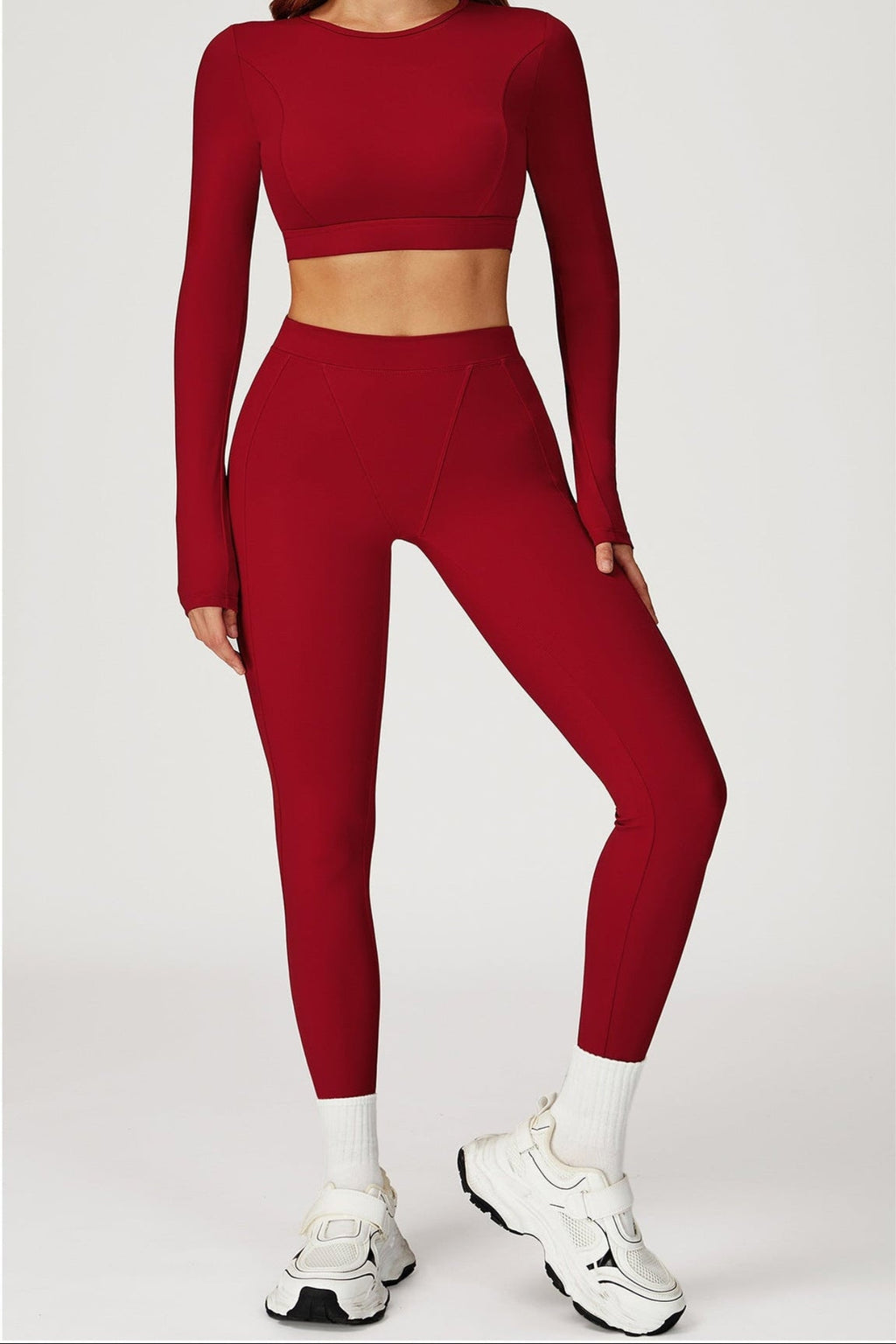 Red long sleeve top paired with matching figure hugging leggings 