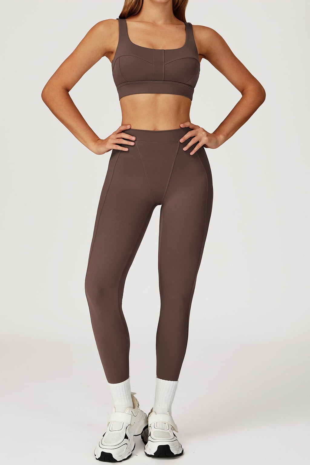 Woman wearing a gym set in burnt umber 