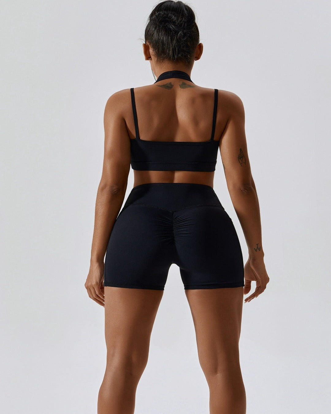 Black crossover scrunch bum mini shorts with pockets