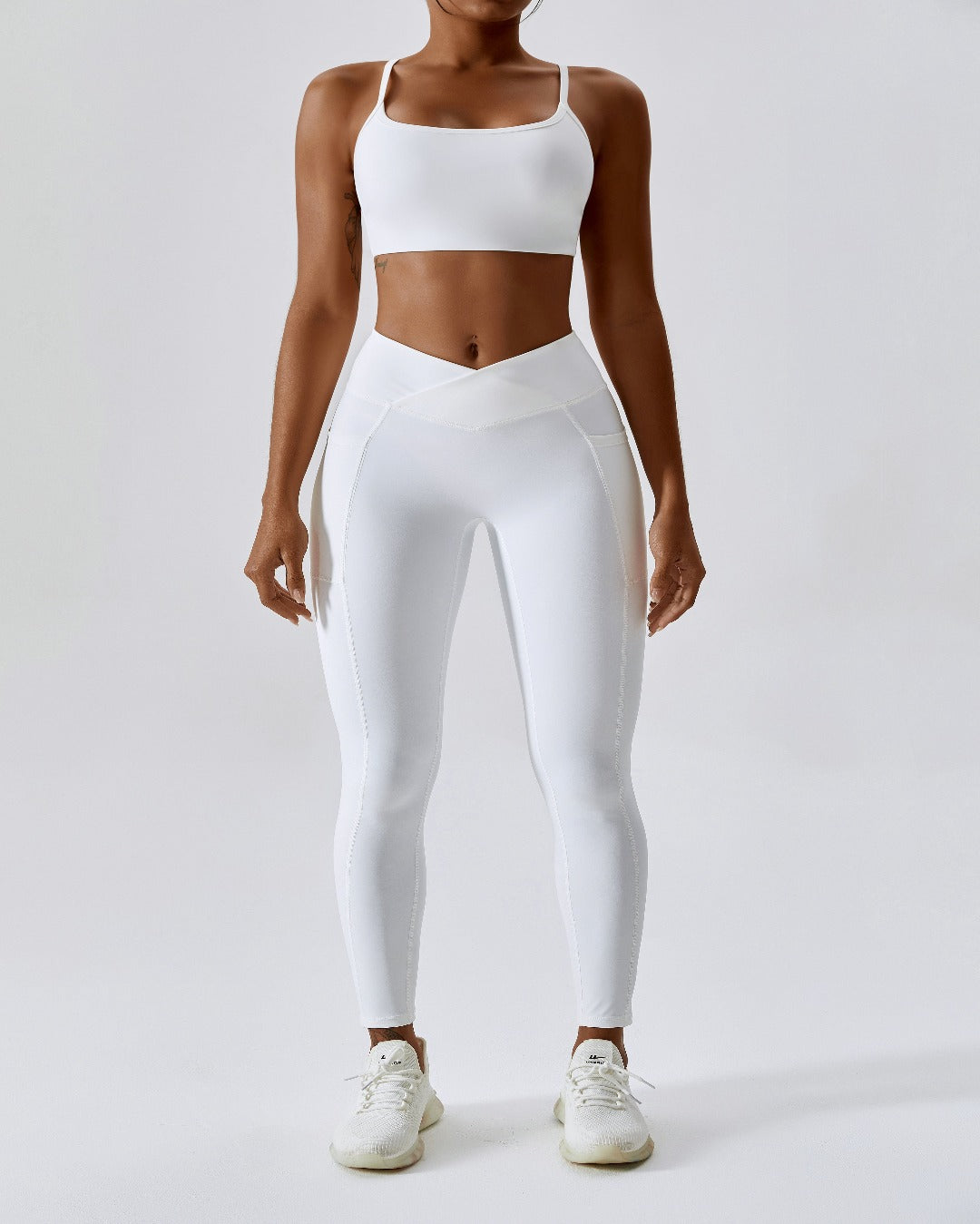 white crossover scrunch bum leggings with pockets