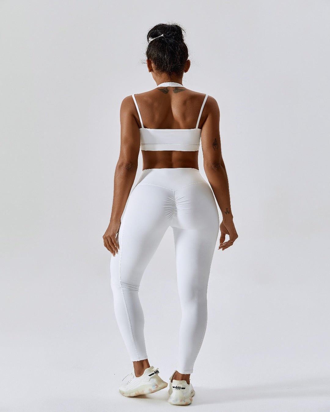 white crossover scrunch bum leggings with pockets